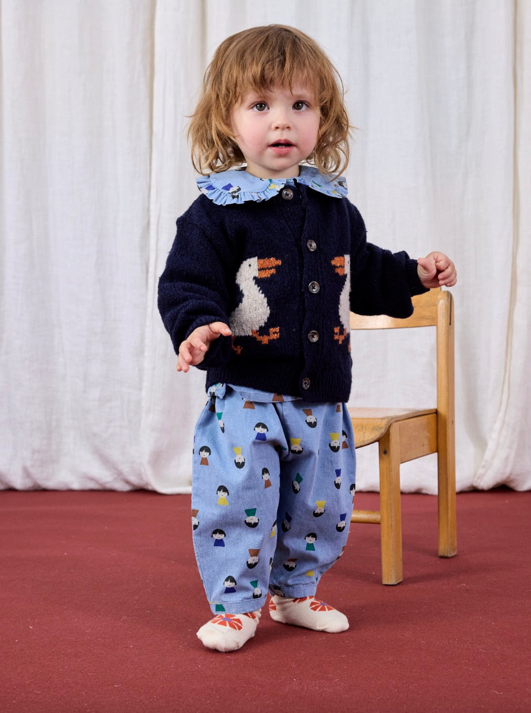 Game Pawns All Over Faces Print Button-Up Light Denim Blouse Light Blue